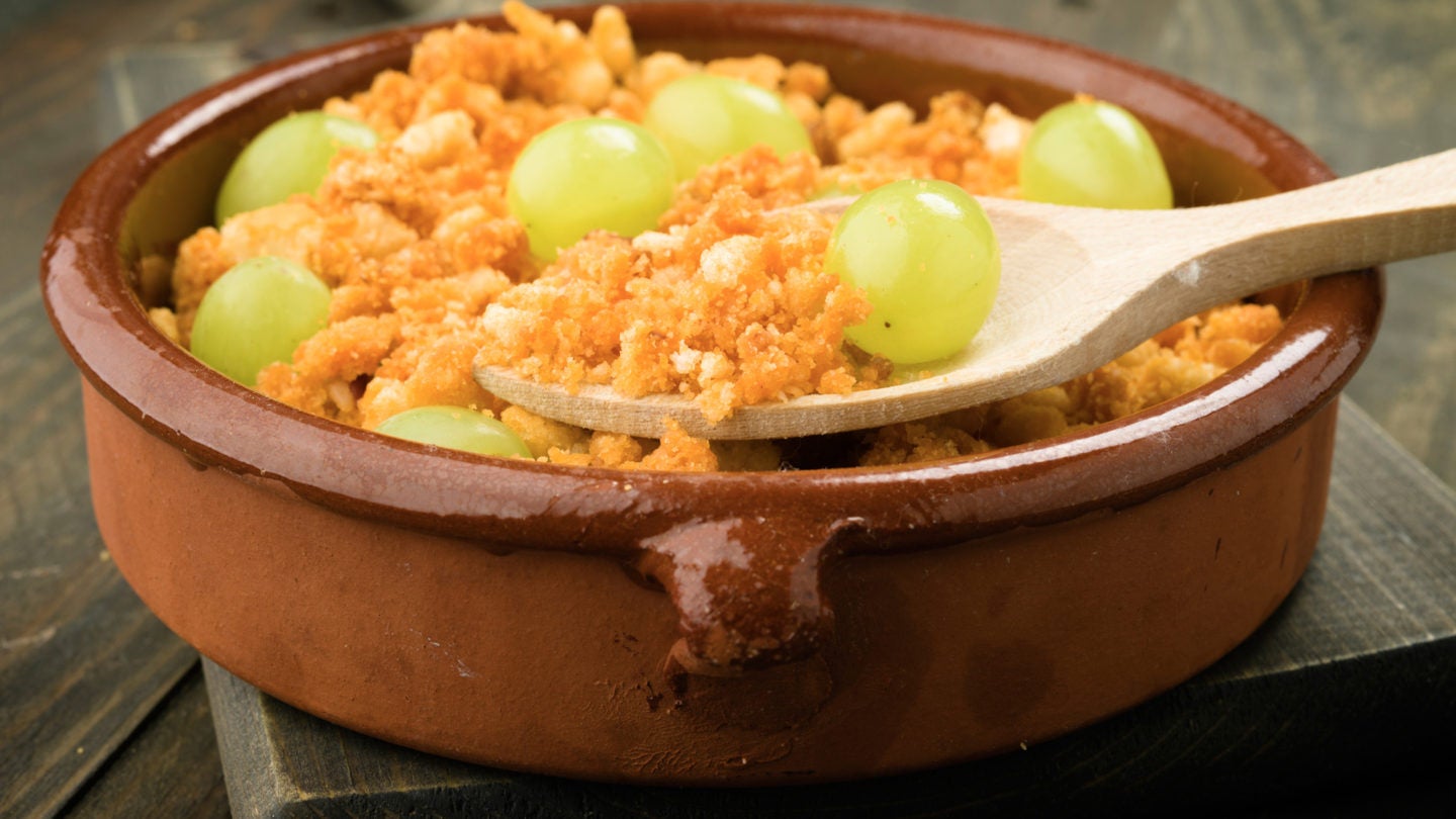 ration shepherd crumbs with fresh grapes, with spoon