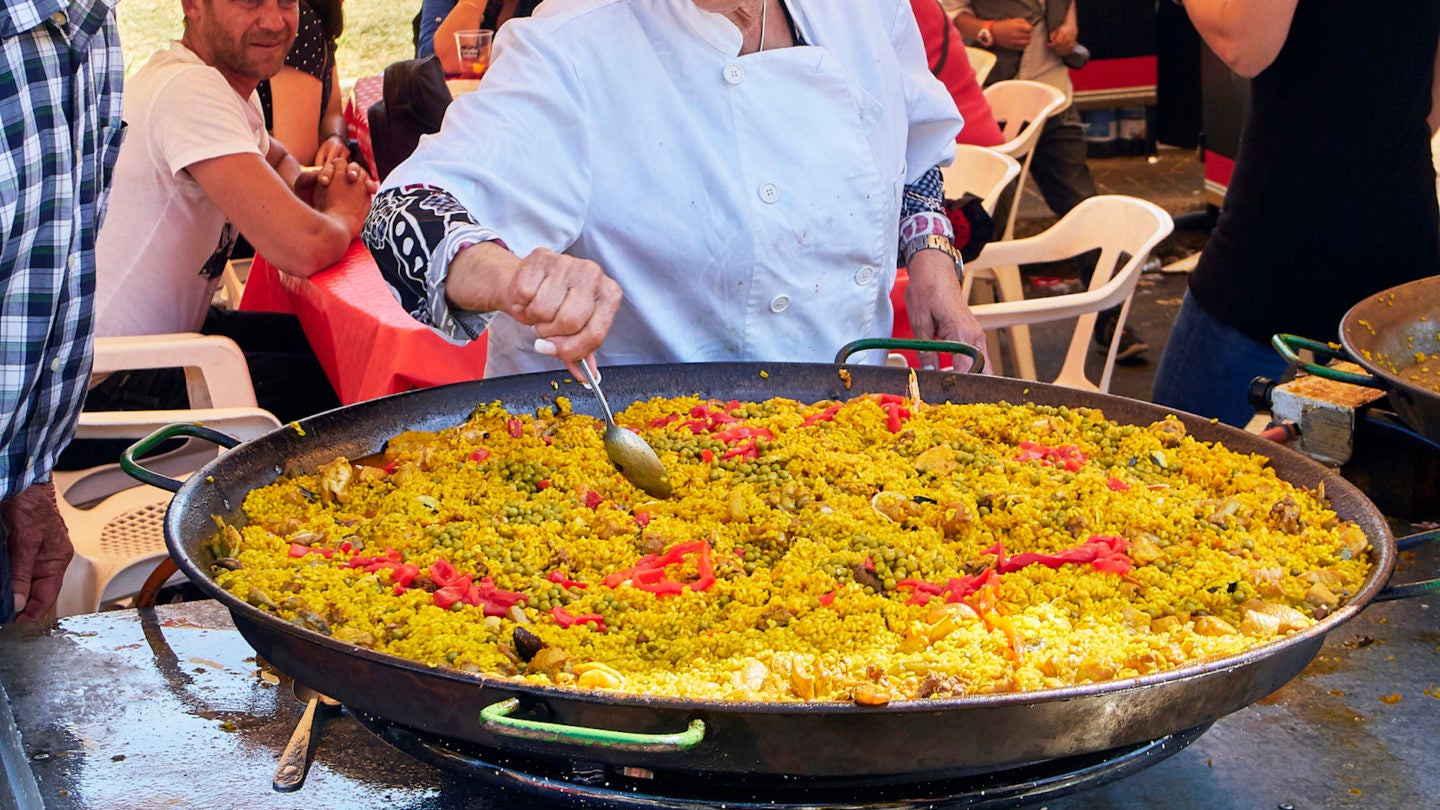 Spanish Paella in progress at a gastronomic fair.